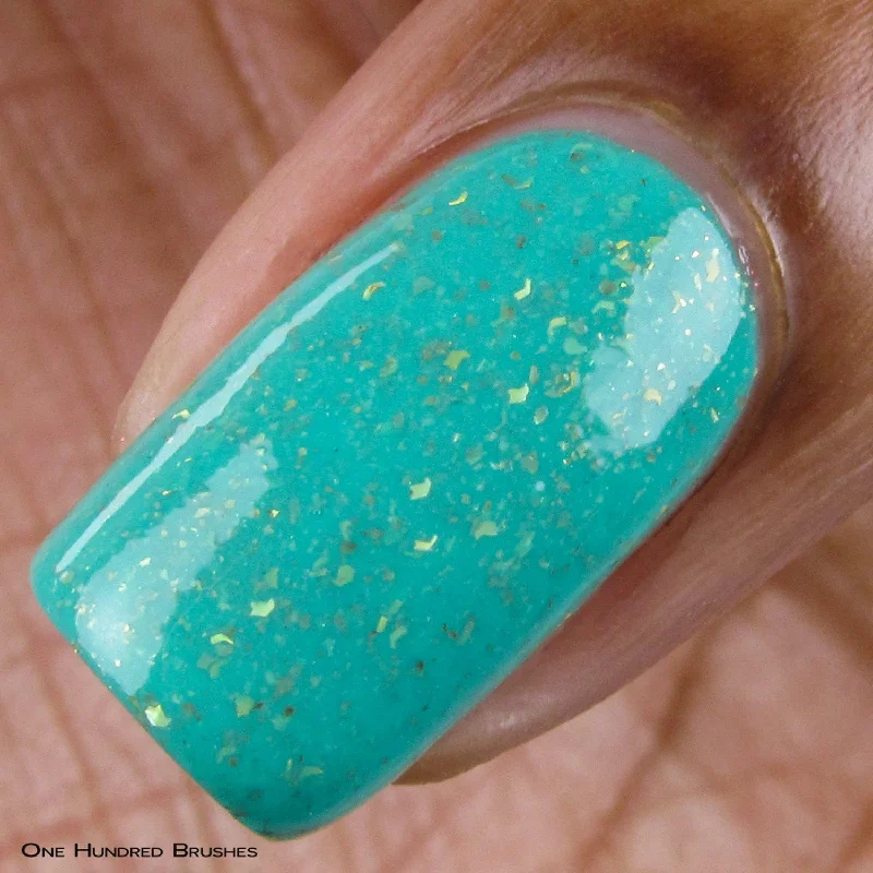 nail polish cinnamon dust-The Wise Build Bridges - matte turquoise blue with gold flakes