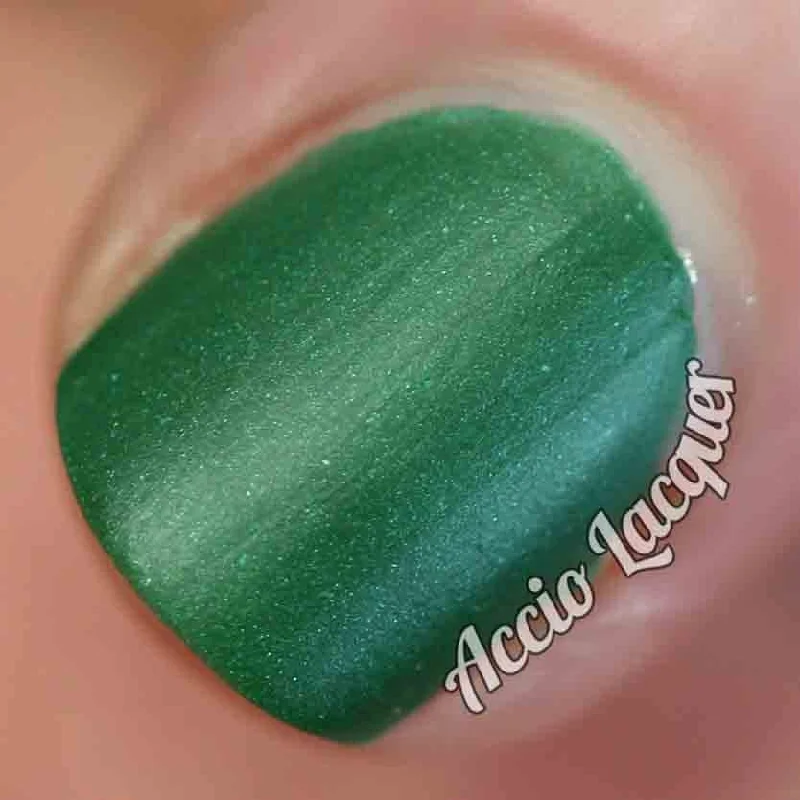 nail polish seaside stroll-Against All Logic Nail Polish - matte green with blue sparkle