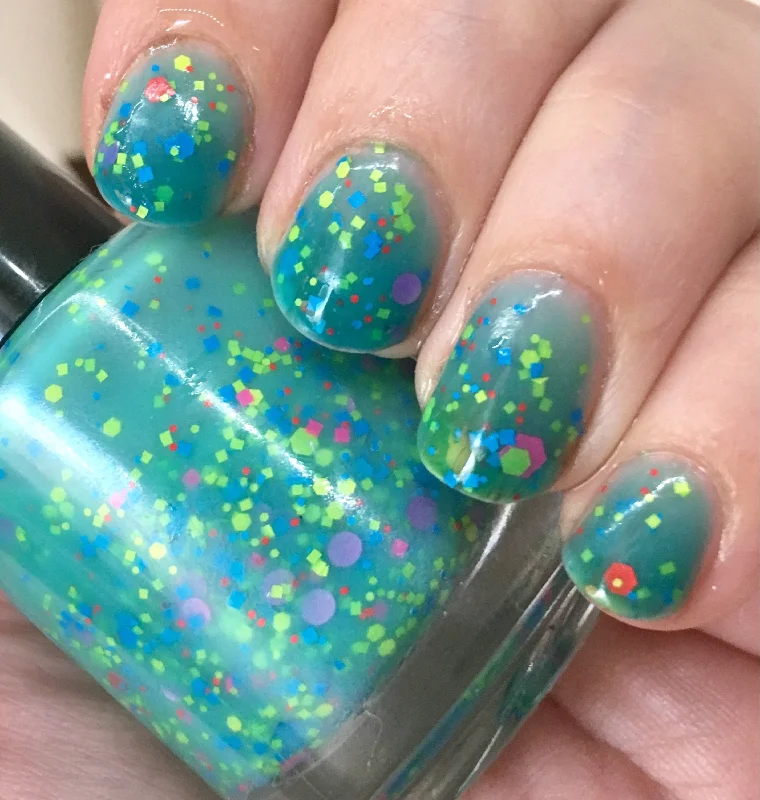 nail polish herbal green-Mathematical! Nail Polish - color changing turquoise to cream with neon glitter